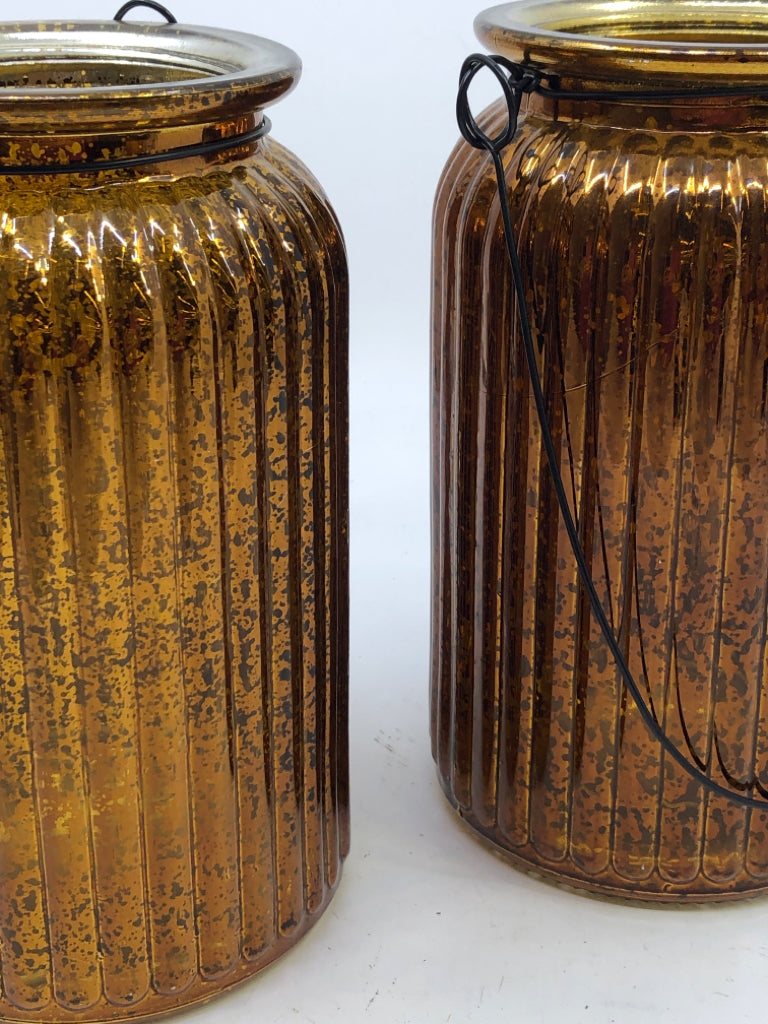 2 TALL GOLDEN MERCURY GLASS CANDLE HOLDER W/WIRE HANDLE.