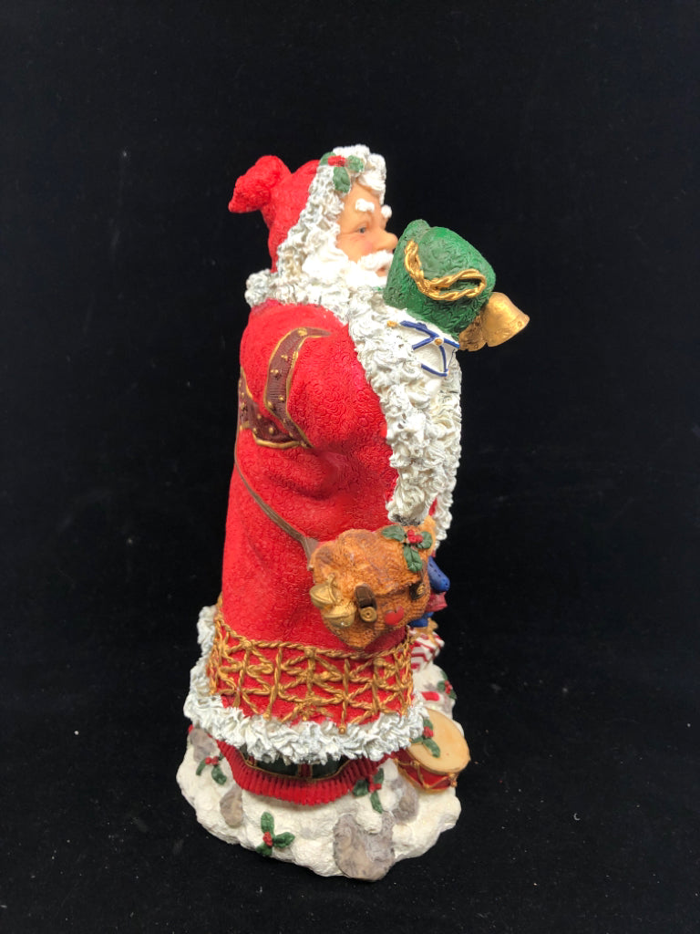 RESIN SANTA W TOYS AND SNOWMAN.