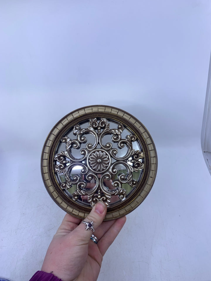 SMALL SILVER SCROLL W/ BROWN EDGE MIRROR.