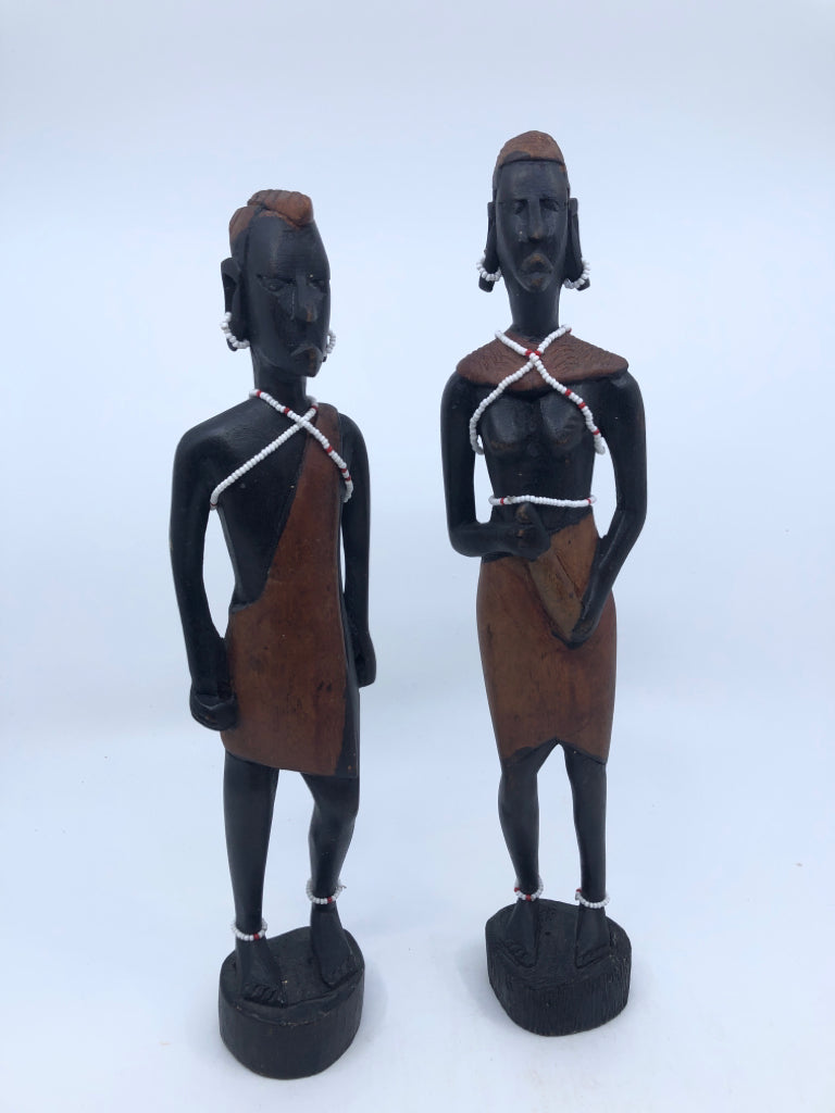 2-WOODEN MAN AND WOMAN CARVED FIGURES W BEADED JEWELRY.