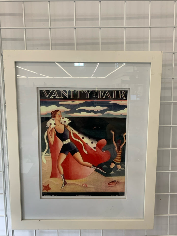 VANITY FAIR OCEAN GUY W CAPE WALL ART IN WHITE FRAME.