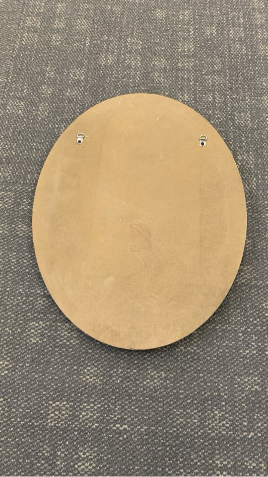 LEAVES EMBOSSED ON ROUND WOOD FRAME.