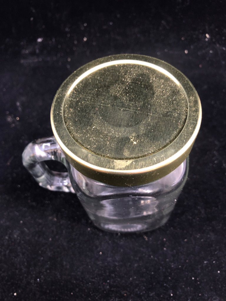 JAR STYLE MUG W HANDLE AND GOLD LID.