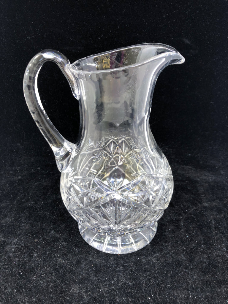 HEAVY CUT CRYSTAL FOOTED PITCHER.