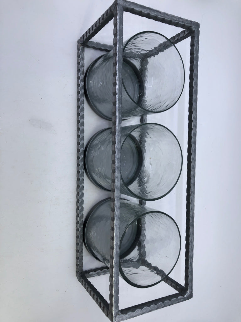 3 CANDLE HOLDERS IN METAL HOLDER.