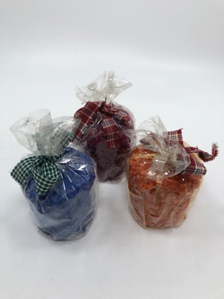 3 MULTI-COLORED TERRY'S VILLAGE CANDLES.