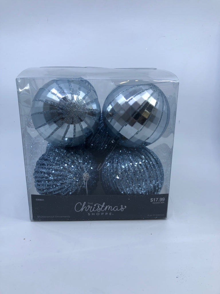 4 BLUE SPARKLE PLASTIC ORNAMENTS.