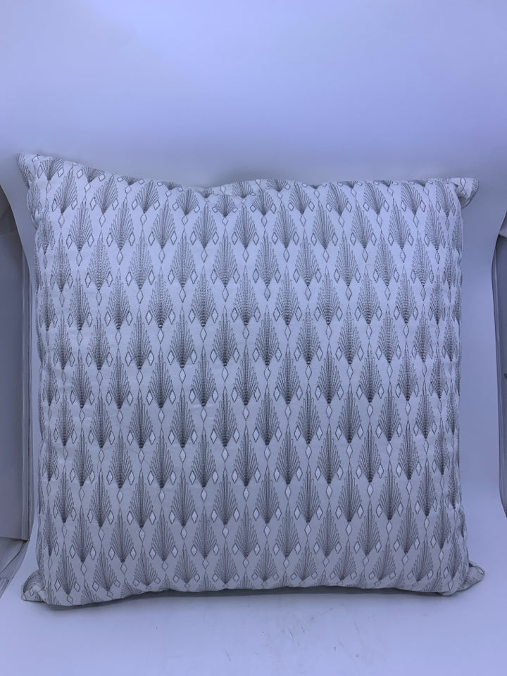 WHITE AND SILVER PATTERN PILLOW.