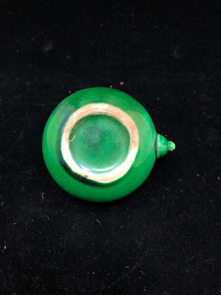 SMALL GREEN GLAZED TEA POT W/WICKER HANDLE.