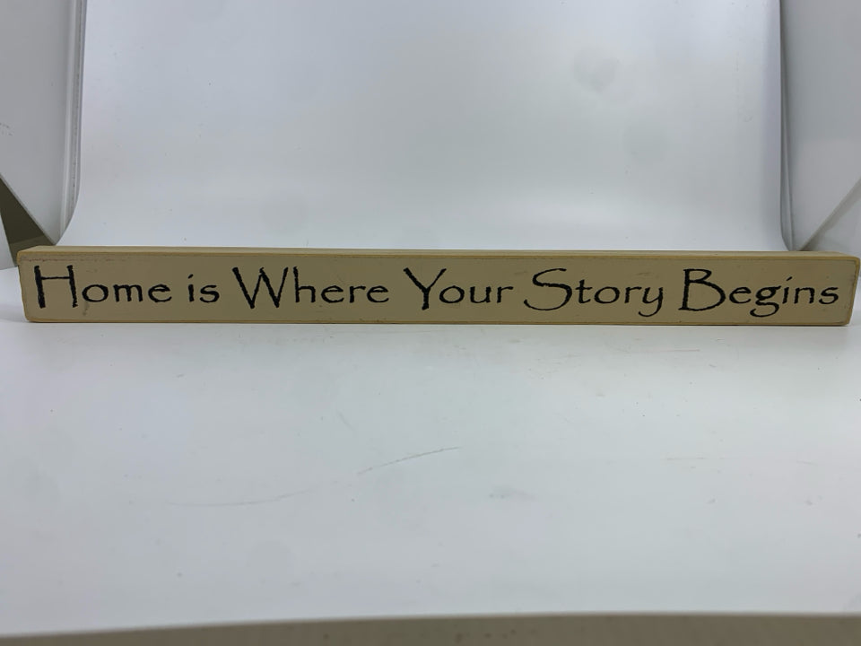 PRIMITIVE 'HOME IS WHERE YOUR' SIGN.