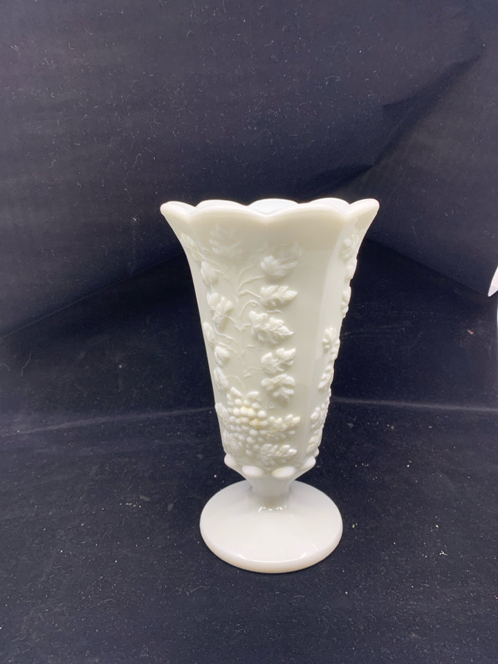 VTG GRAPE PATTERN EMBOSSED FOOTED MILK GLASS VASE.