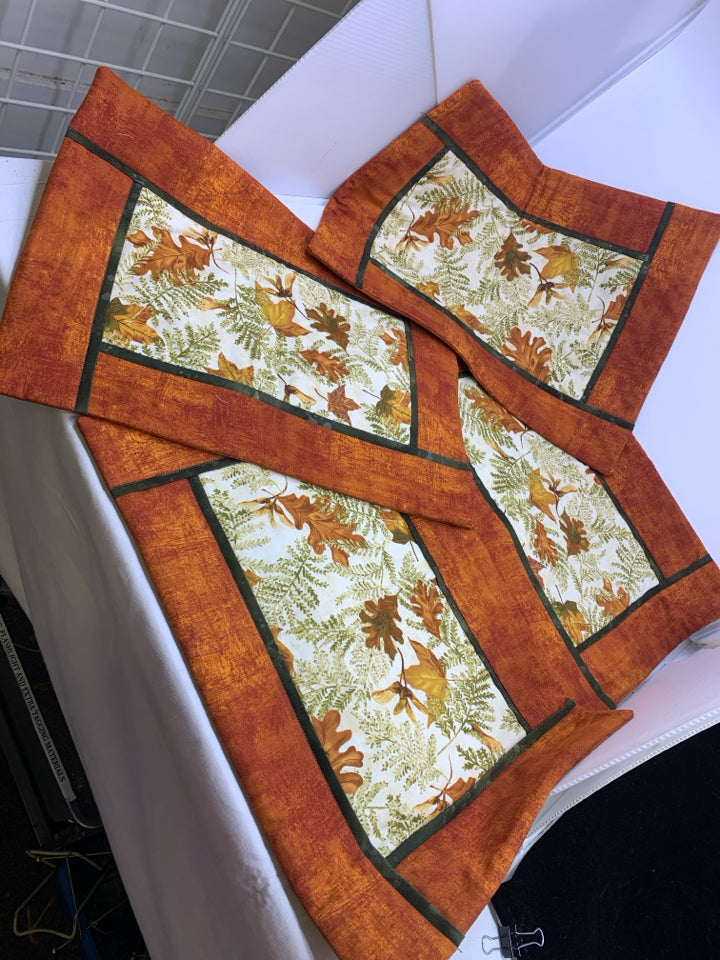 4 ORANGE LEAF PATTERN QUILTED PLACEMATS.