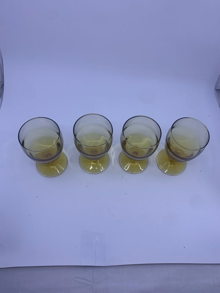 4 AMBER GLASS FOOTED GOBLETS.