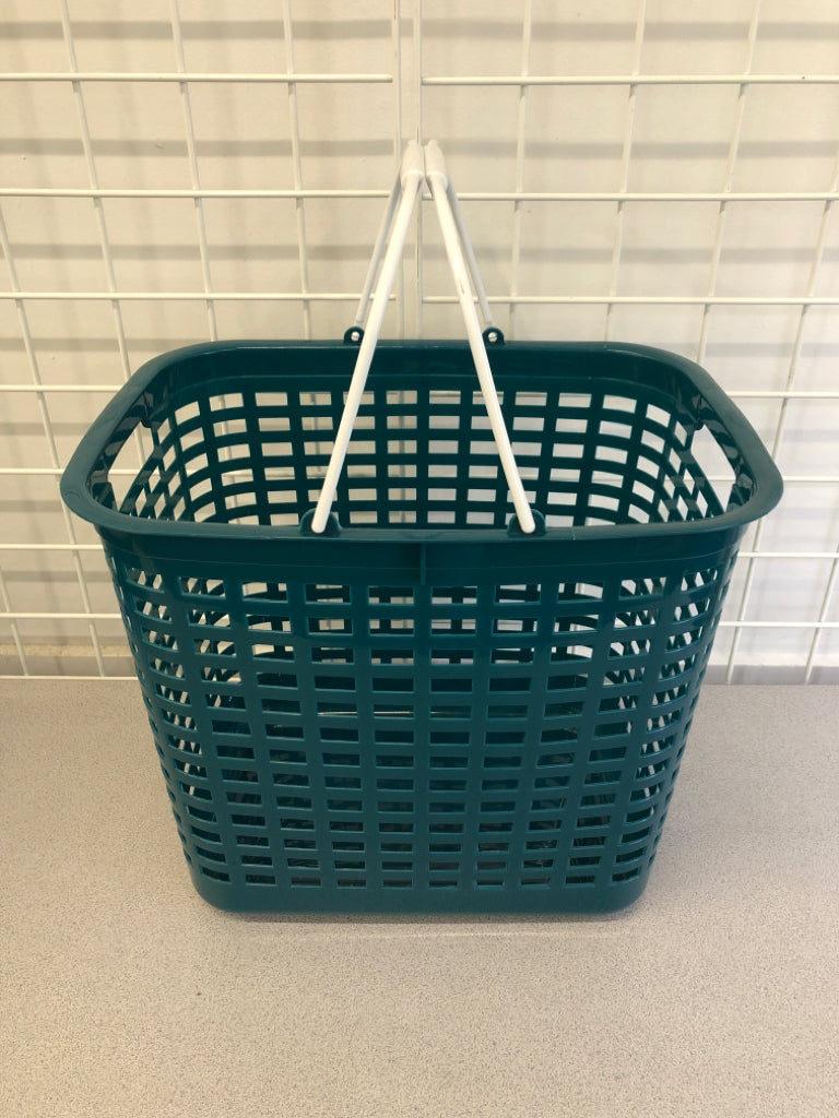 PLASTIC TEAL LAUNDRY BASKET W/WHITE HANDLE.