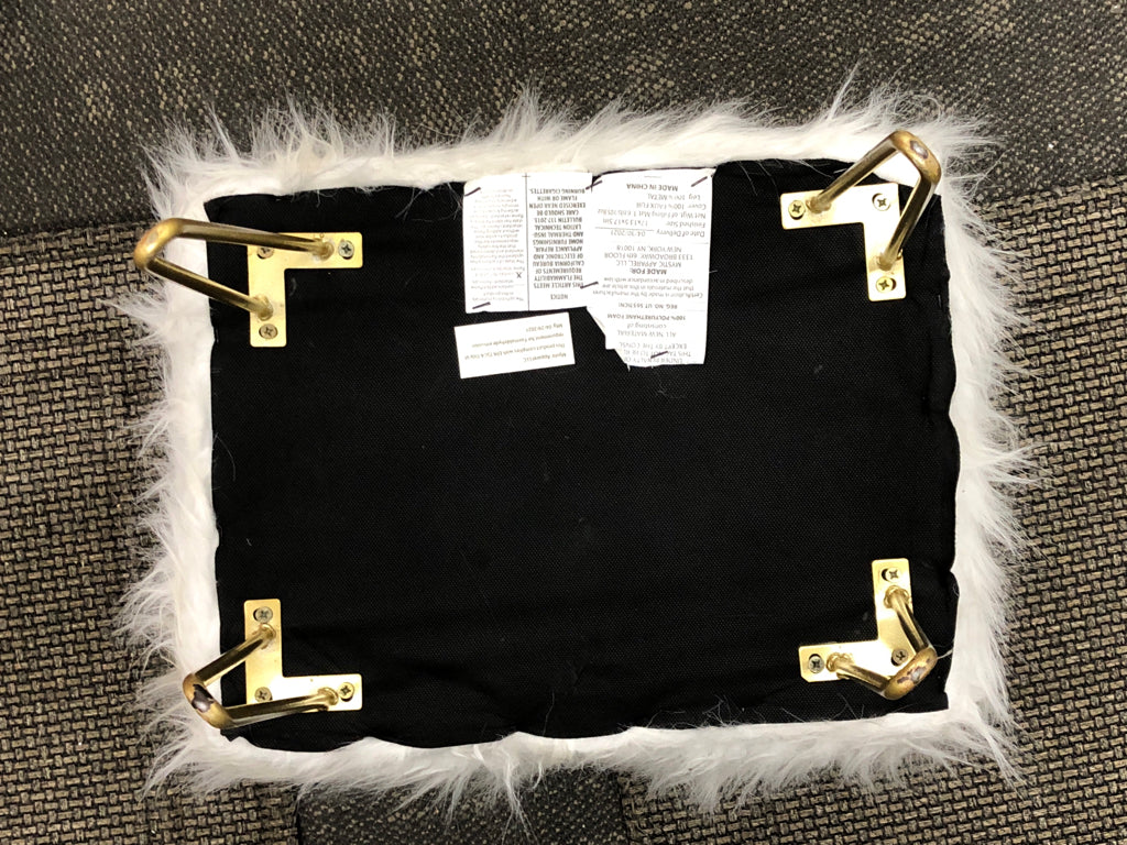 WHITE FURRY FOOTSTOOL W/GOLD LEGS.