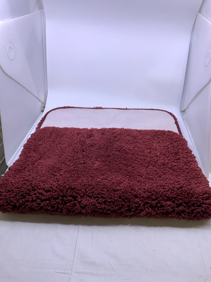RED BATH MAT.
