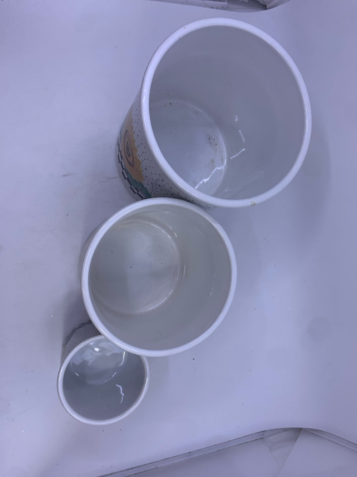 3 SUNFLOWER CANISTER W/ BLACK LIDS.