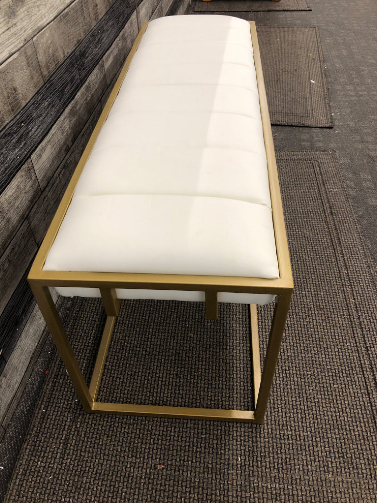 UPHOLSTERED WHITE FAUX-LEATHER BENCH W/GOLD FRAME.