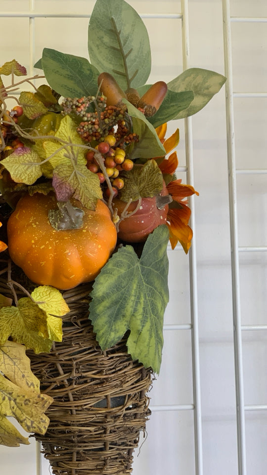 FAUX ORANGE CORNUCOPIA FLORAL ARRANGEMENT.