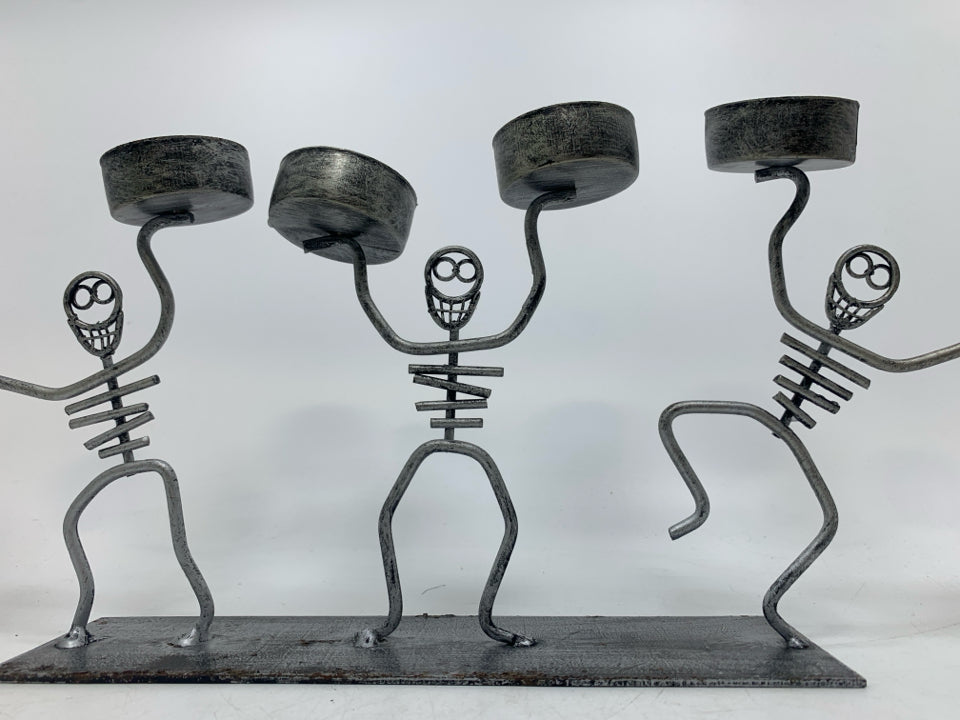 SKELETONS TEA LIGHT HOLDER.