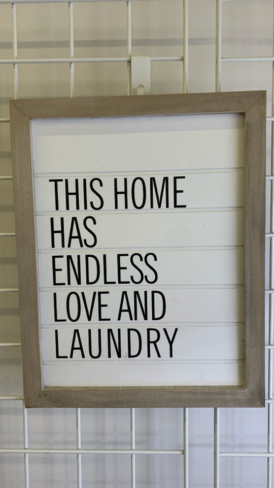 WHITE WASHED FRAME THIS HOME WALL HANGING.