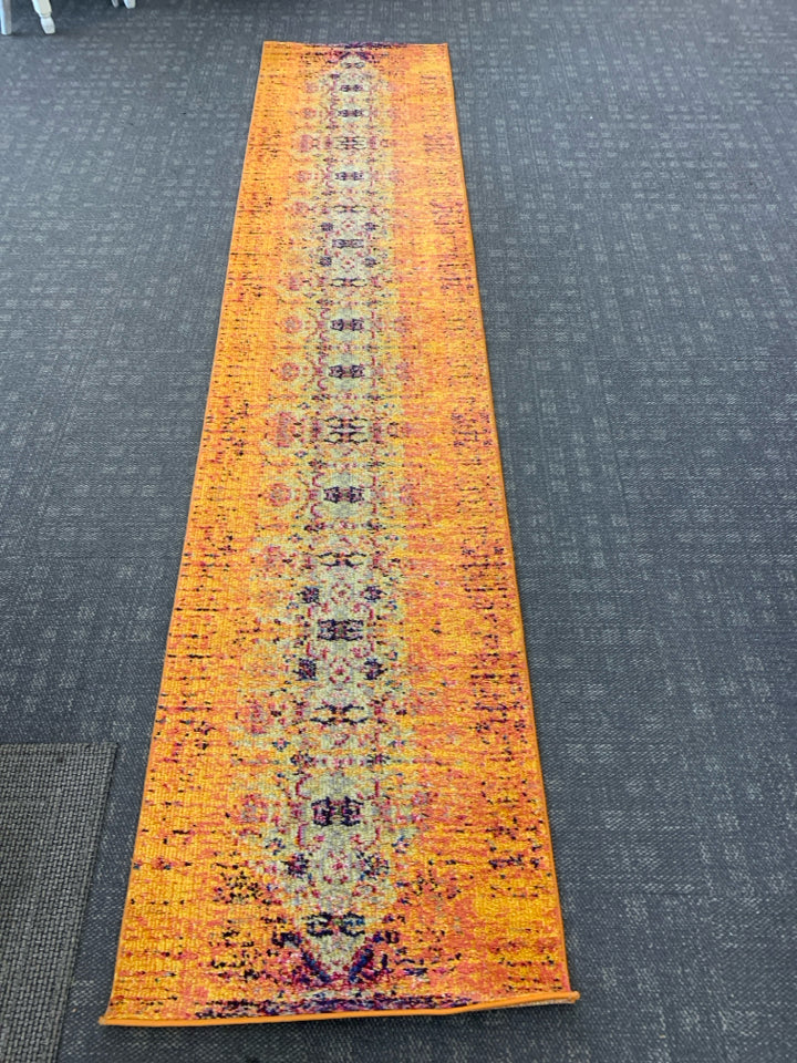 ORANGE MULTI COLORED RUG RUNNER.
