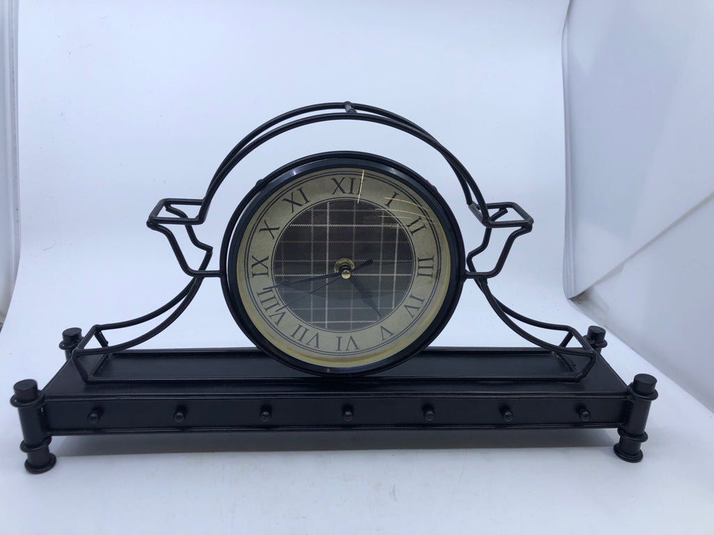 METAL SHELF CLOCK, PLAID BACKGROUND.