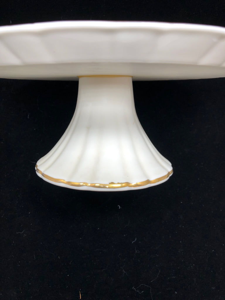 RAISED CAKE STAND W/GOLD TRIM.