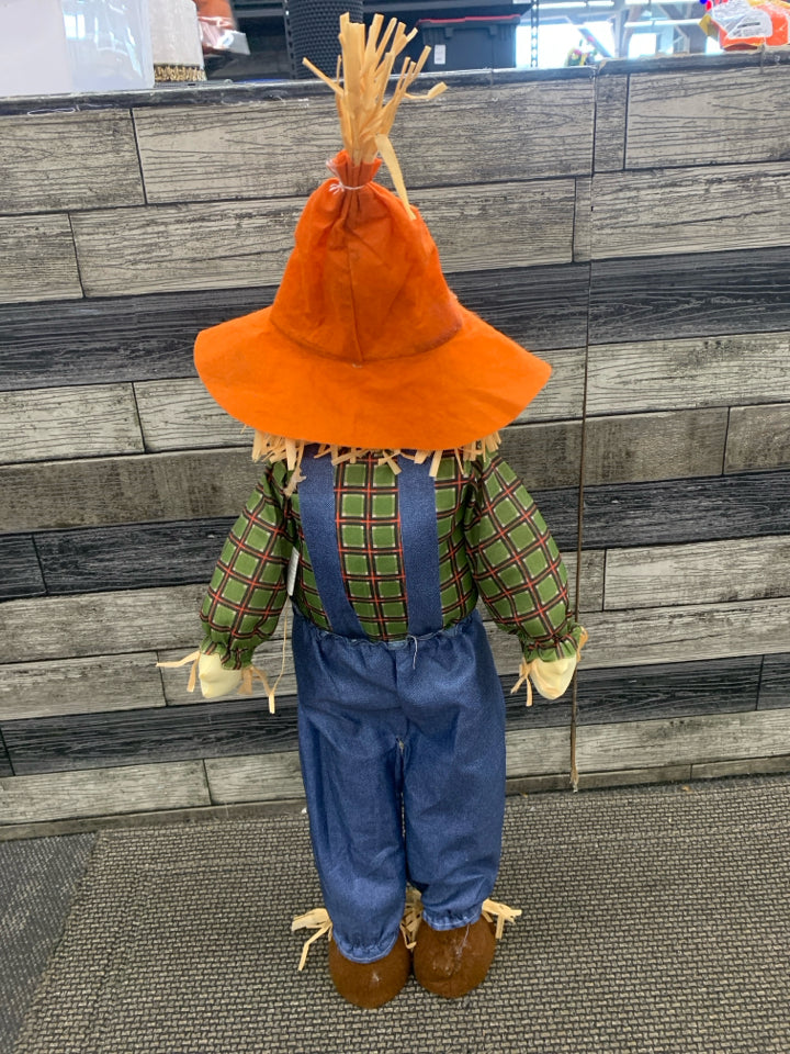 SCARECROW IN BLUE OVERALLS STANDING DECOR.