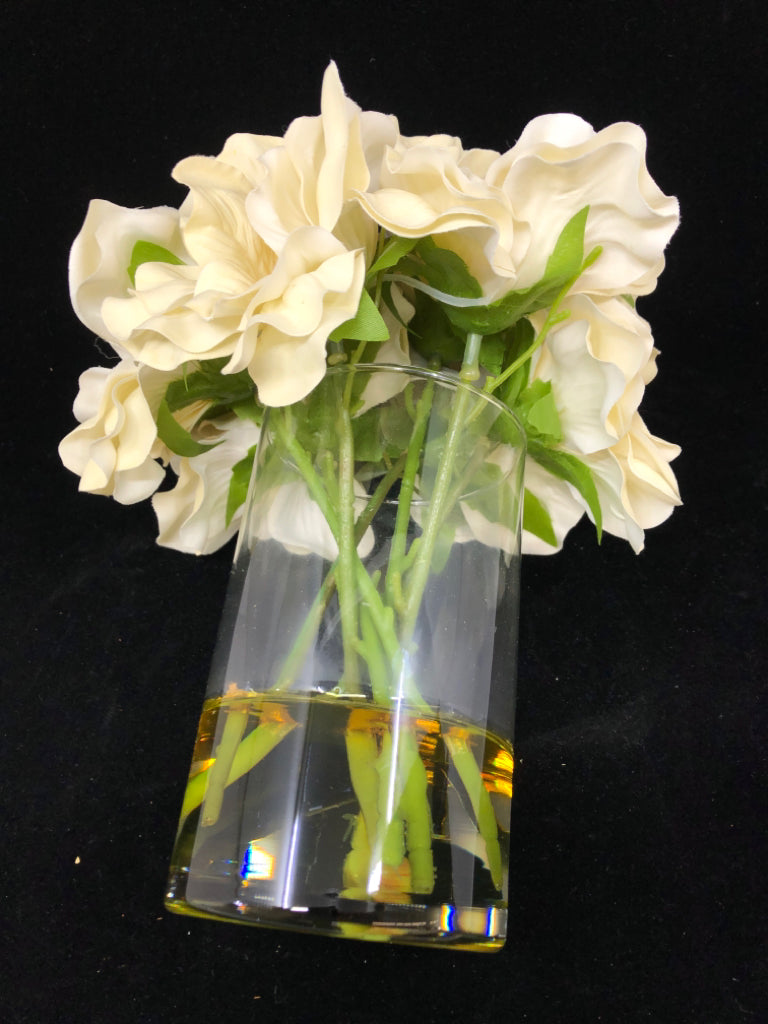 FAUX WHITE FLOWERS IN GLASS VASE.