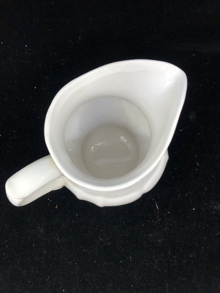 WHITE CERAMIC PITCHER VASE.