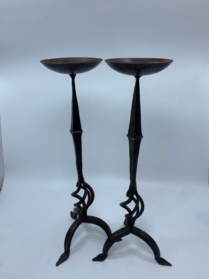 2 BROWN METAL PILLAR CANDLE HOLDERS.