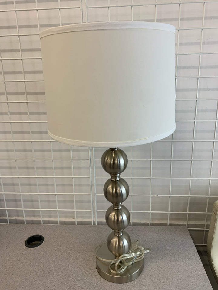 SILVER BUBBLE LAMP W/WHITE BARREL SHADE.