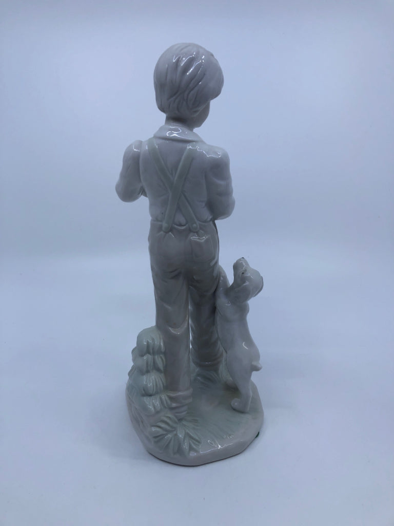 BOY W/DOGS PORCELAIN FIGURINE.