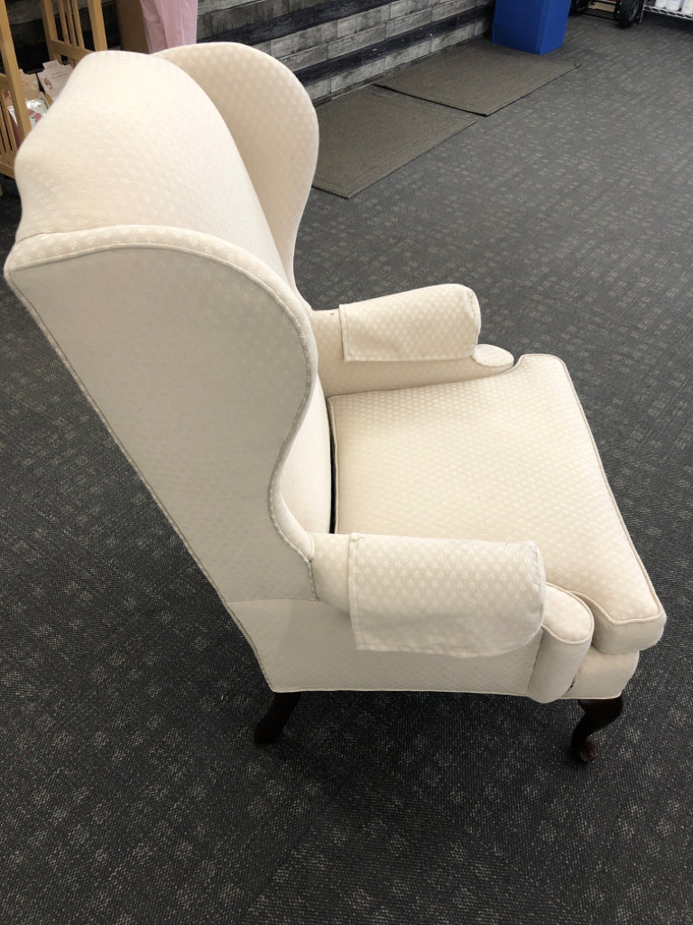 VTG CREAM WING-BACK CHAIR.