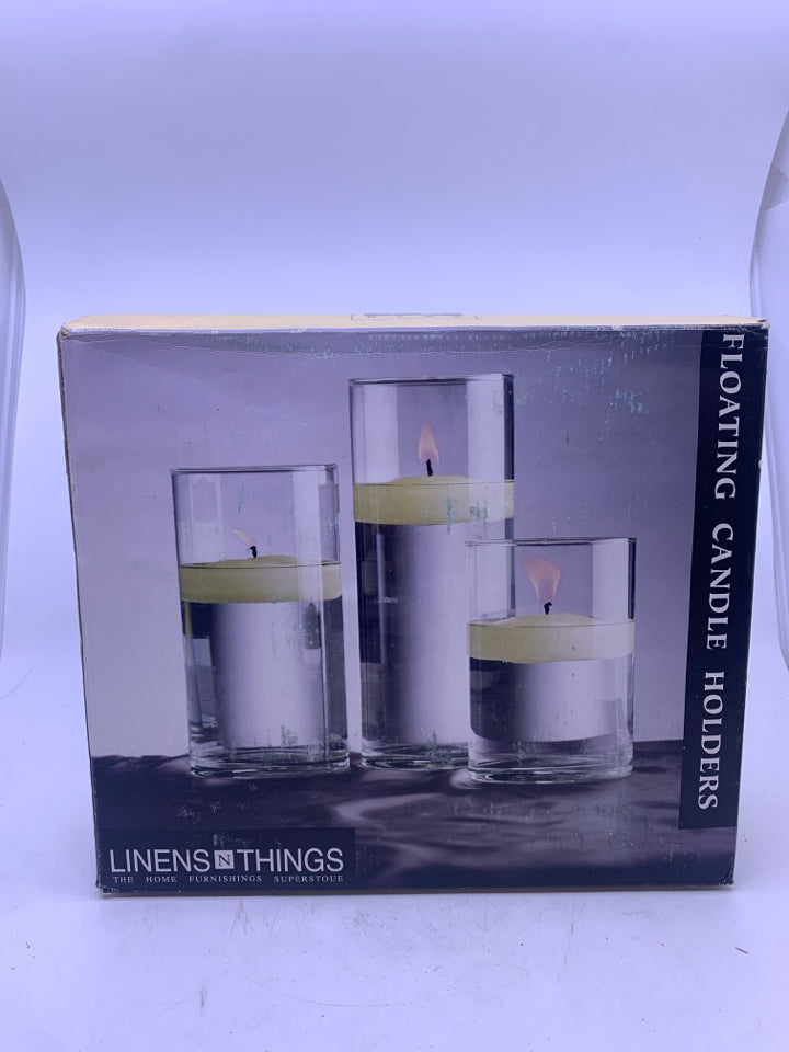 NIB FLOATING CANDLE HOLDERS.