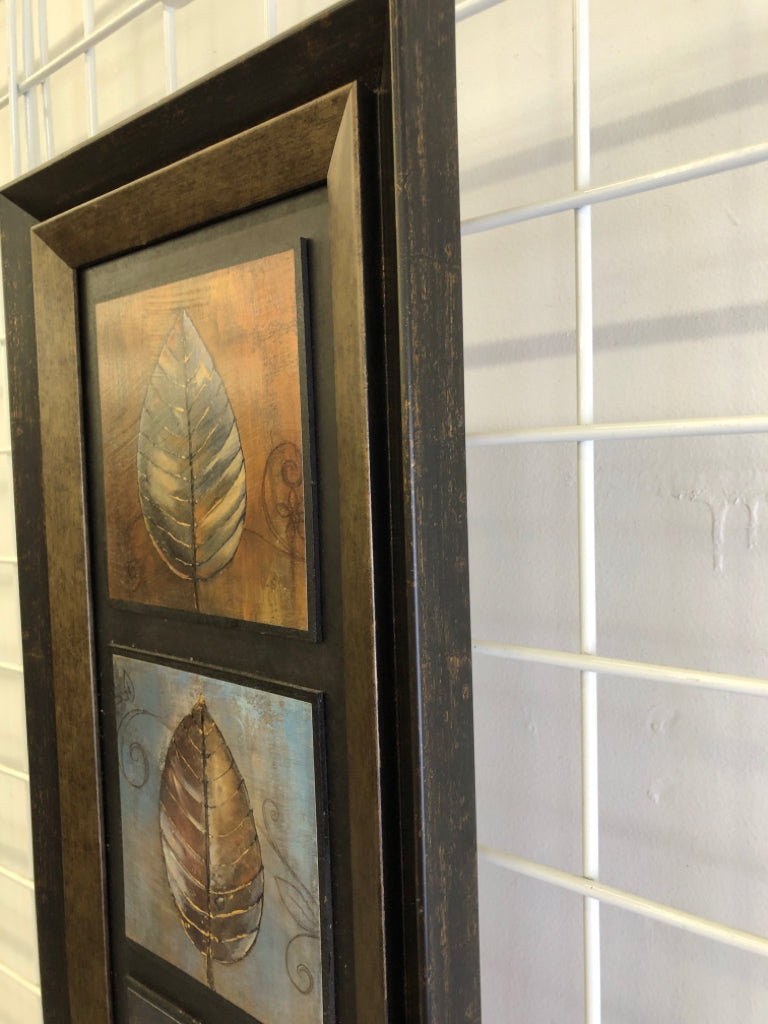 WOOD PAINTED LEAVES IN BROWN FRAME.