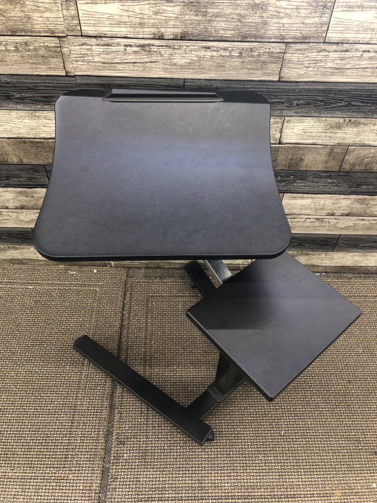 BLACK PLASTIC COMPUTER DESK ON WHEELS.