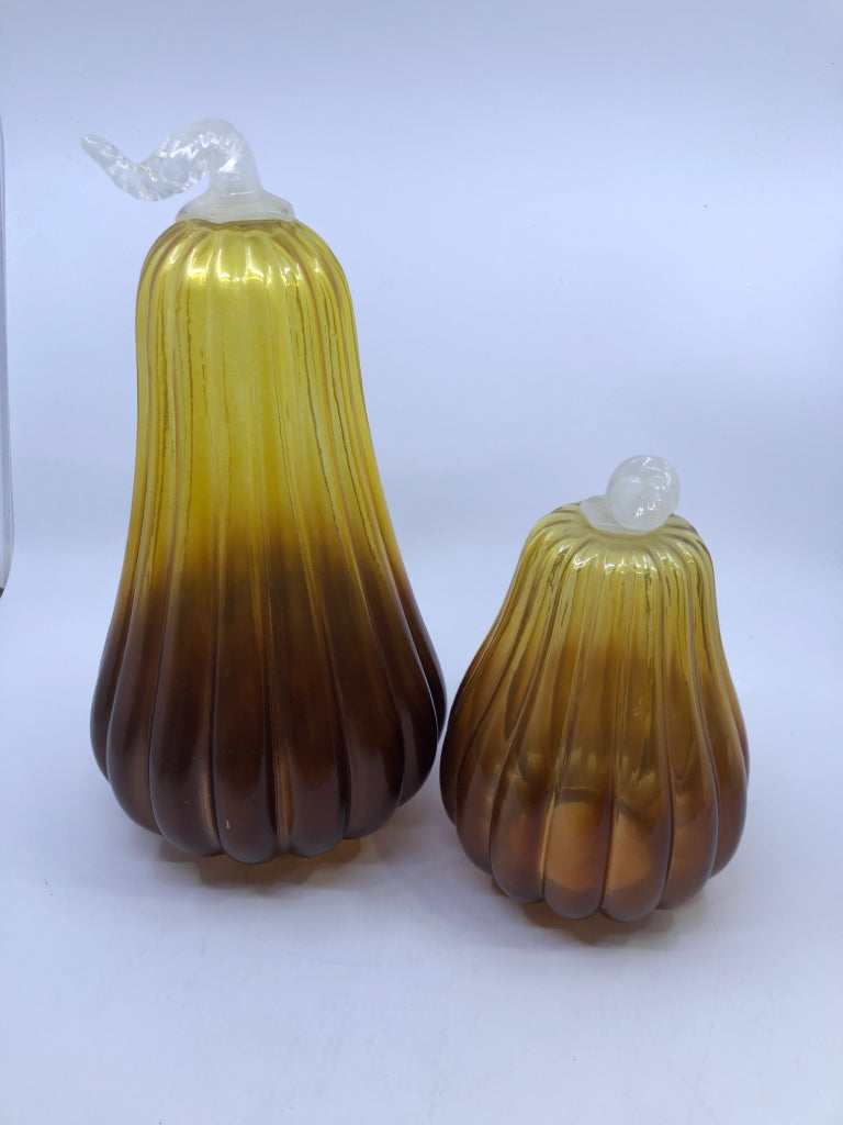 2 AMBER/YELLOW GLASS PUMPKINS W/ WHITE STEM.