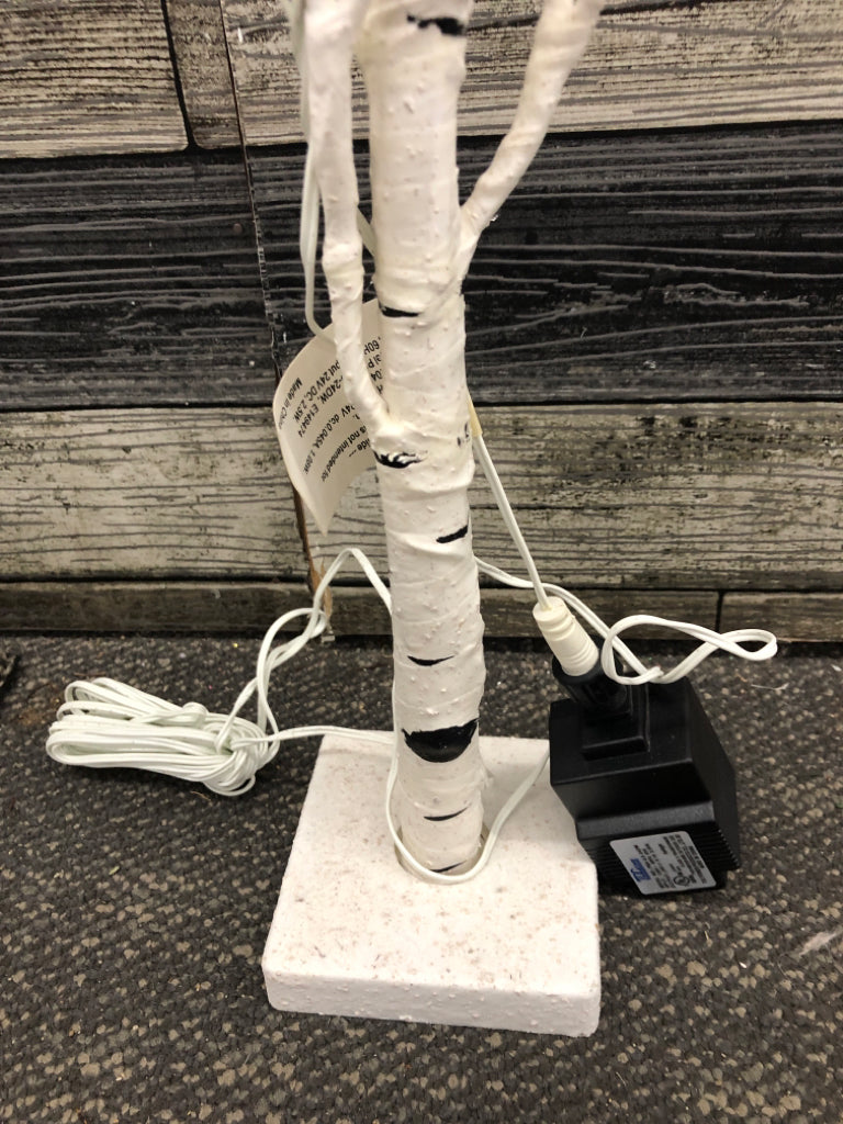 WHITE & BLACK DISTRESS LIGHT UP TREE ON WHITE BASE.