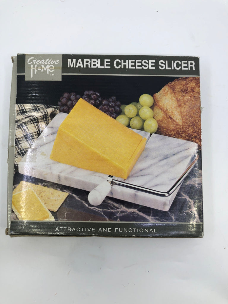 NIB MARBLE CHEESE SLICER.