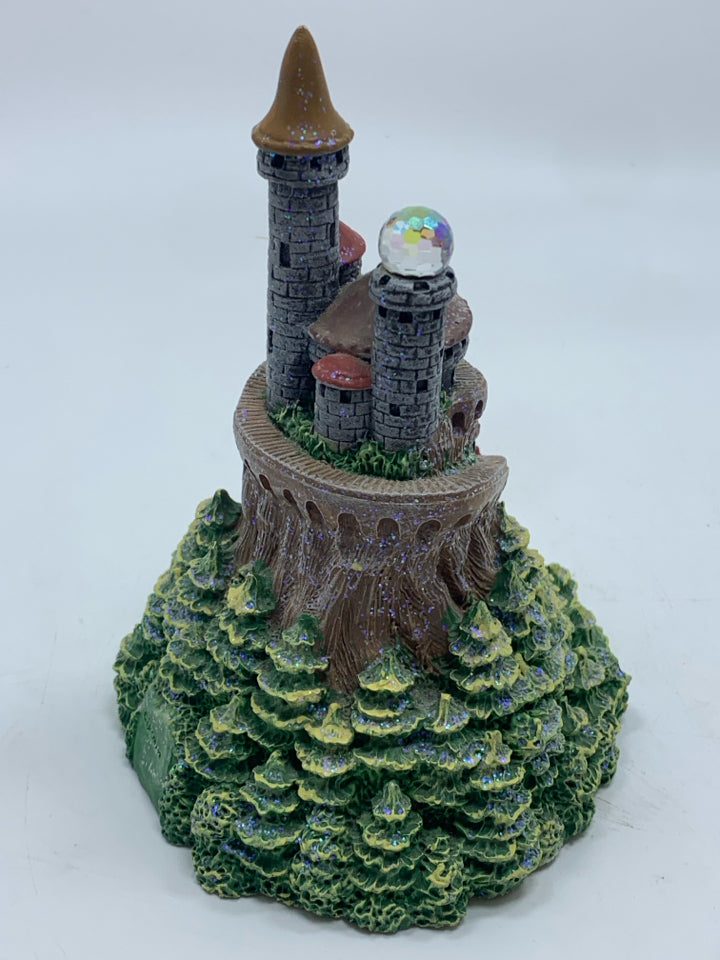 CASTLE WITH CRYSTAL BALL FIGURINE.