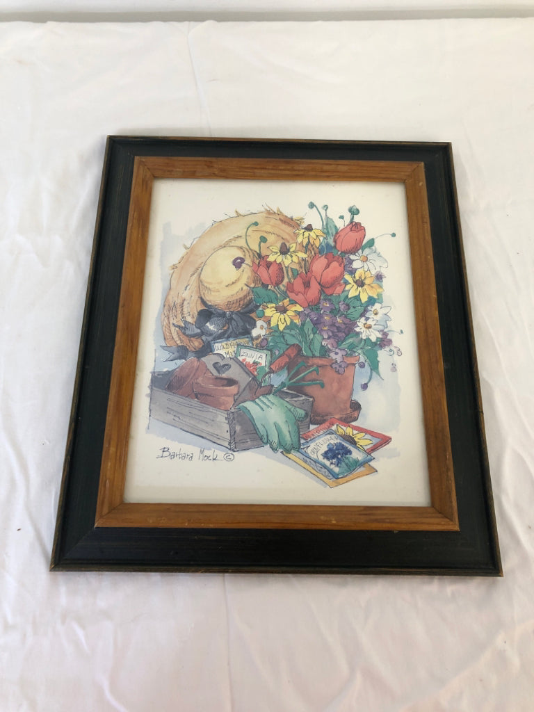 BARBARA MOCK PAINTING OF GARDENING SUPPLIES WALL ART IN DARK GREEN FRAME.