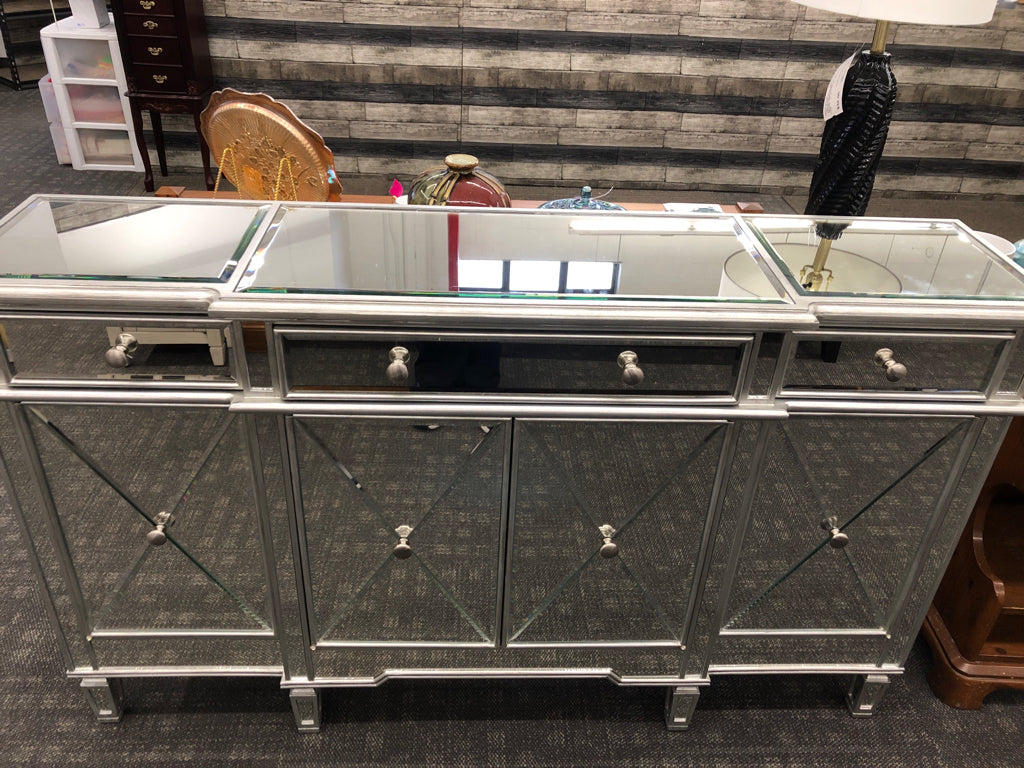 MIRRORED CONSOLE TABLE W/3 DRAWERS & 4 DOORS.