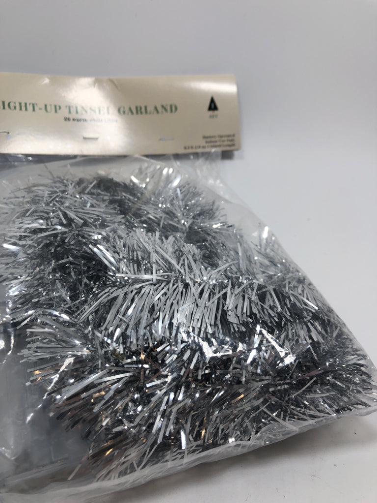 NIP SILVER TINSEL GARLAND W/ LED LIGHTS.