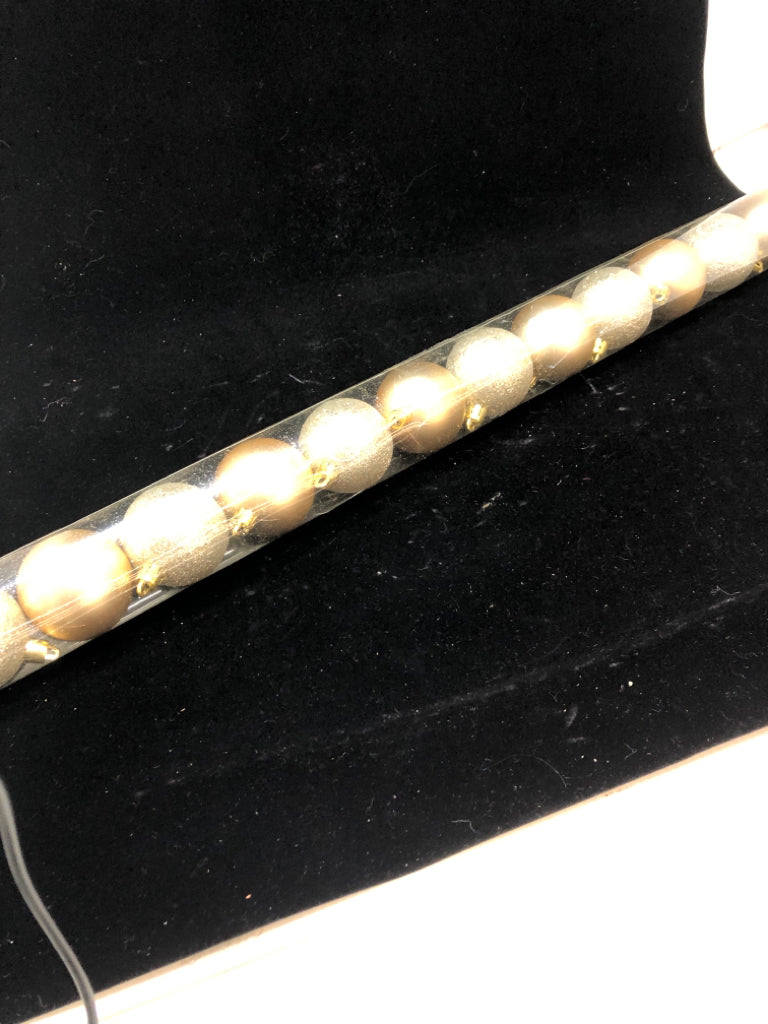12 GOLD SPARKLE ORNAMENTS IN TUBE.