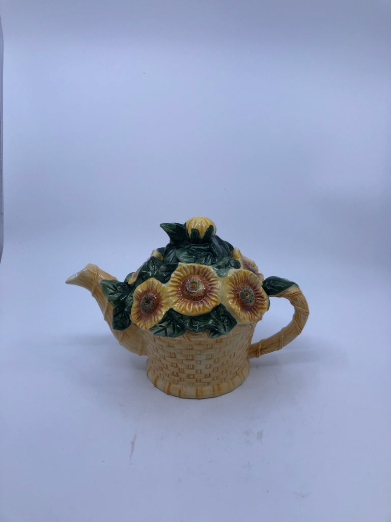 CERAMIC TEAPOT BASKET SHAPED W/ EMBOSSED SUNFLOWERS.