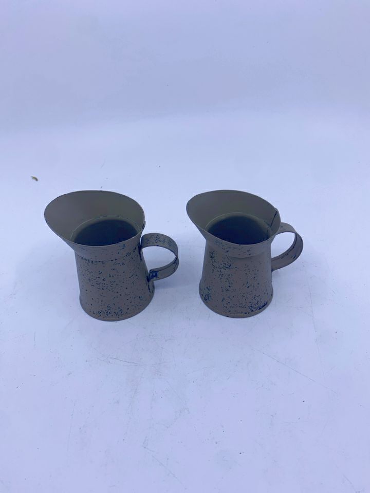 2 TAN METAL PITCHERS.