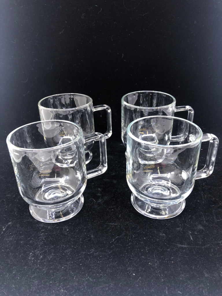 4 FOOTED GLASS MUGS.