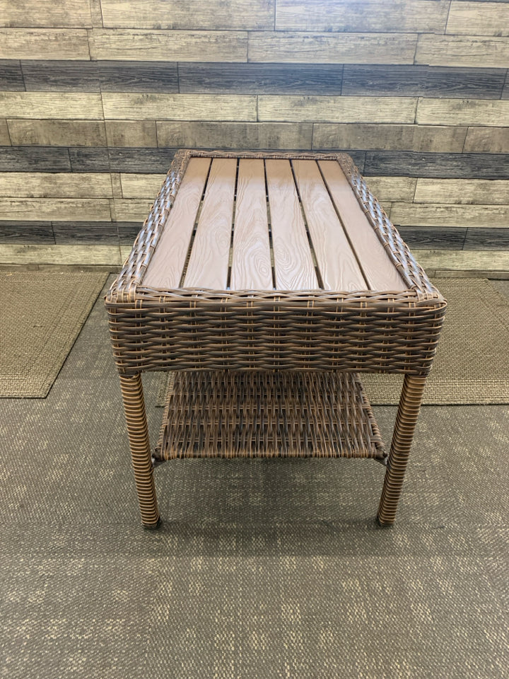 DARK WICKER W FAUX WOOD TOP COFFEE TABLE.